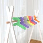 Girls set of clothes hangers in a rack