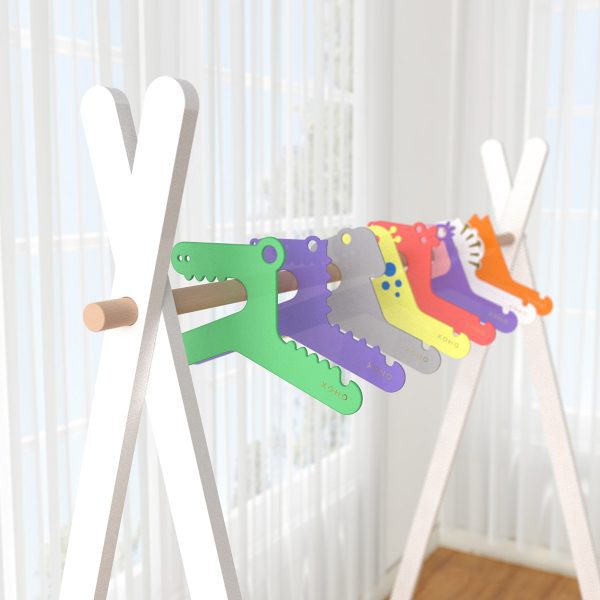 Girls set of clothes hangers in a rack