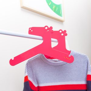 Kids clothes hanger red hippo in a rack